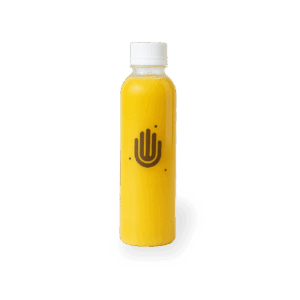 Botella de jugo energético de 250 ml elaborado con manzana, jengibre, limón y miel